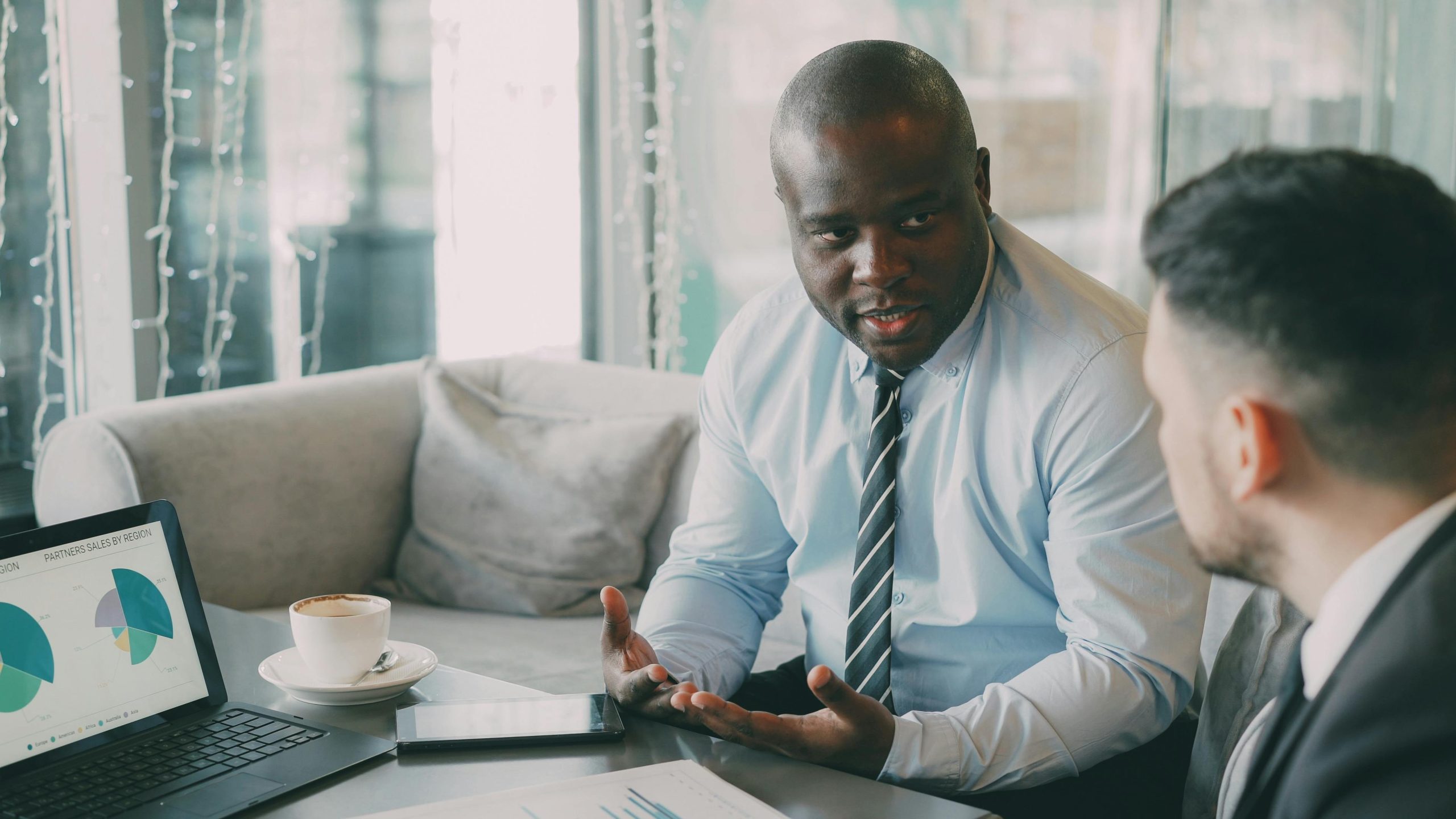 Illustrative photograph of a finance professional reviewing information at a desk